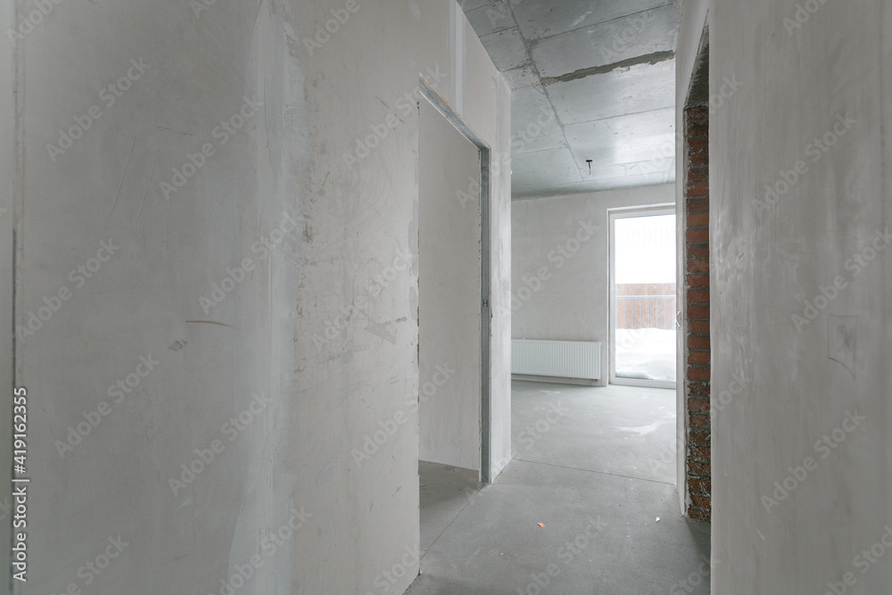 interior of the apartment without decoration in gray colors. rough finish interior of the apartment without decoration in gray colors. rough finish