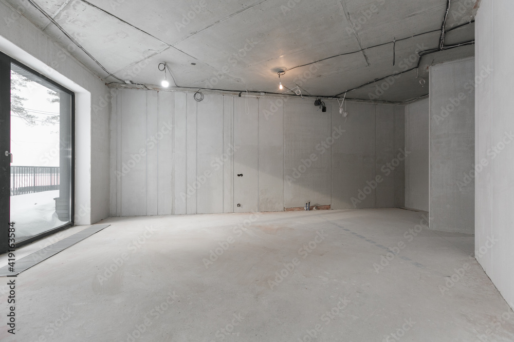 interior of the apartment without decoration in gray colors. rough finish