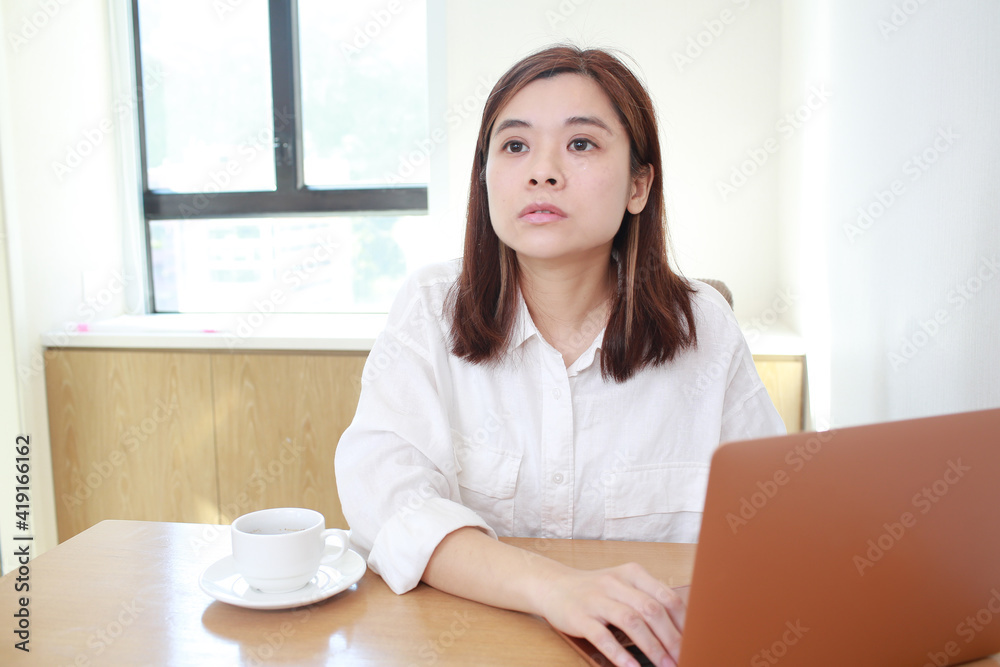 woman concentrate to her work at home as the house wife and business woman woman concentrate to her work at home as the house wife and business woman