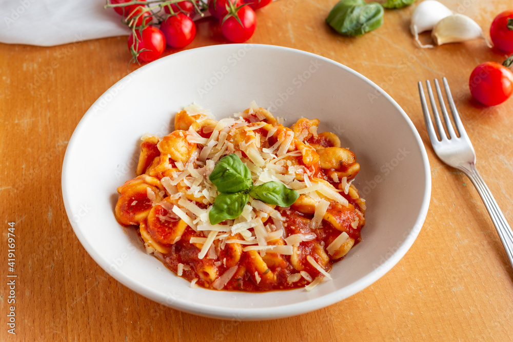 orecchiette pasta with tomato sauce, parmesean and basil orecchiette pasta with tomato sauce, parmesean and basil
