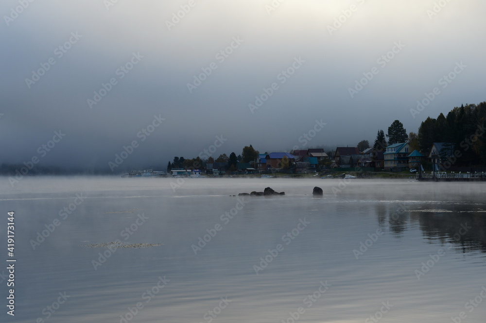 Morning fog on Lake Teletskoye. Altai Republic