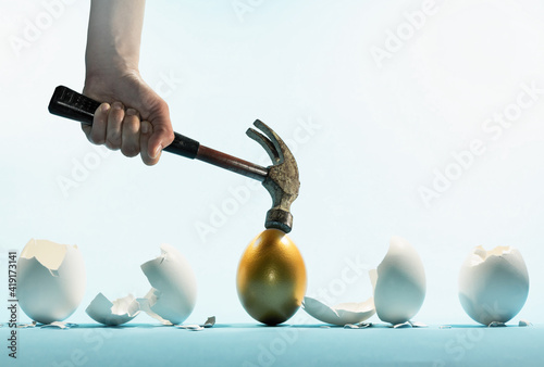 Slika na platnu Intact golden egg among broken white eggs
