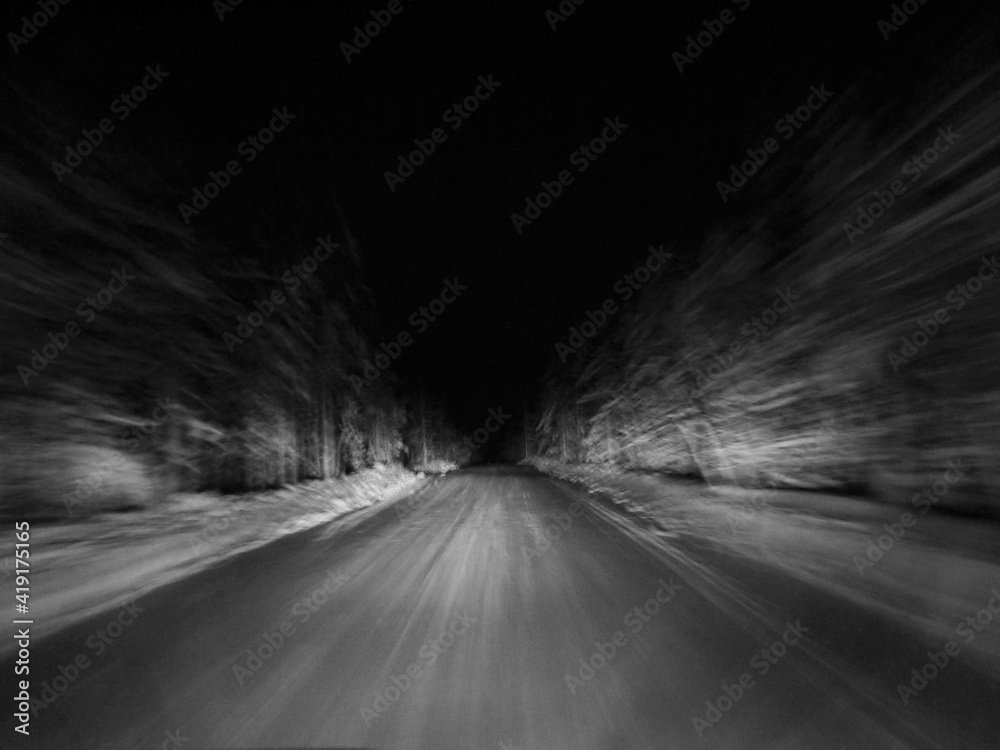 Blurs. Speed. Night. The headlights illuminate the winter track.
