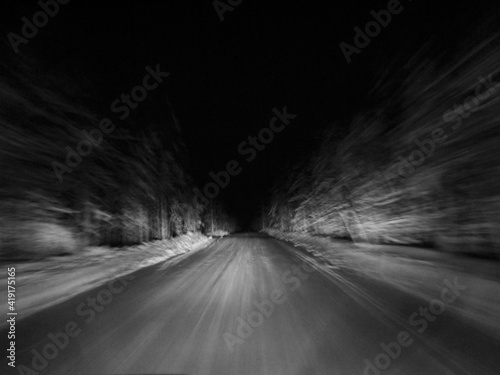 Blurs. Speed. Night. The headlights illuminate the winter track.