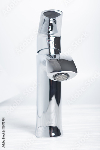 New steel mixer tap for bathroom sinks in hotel