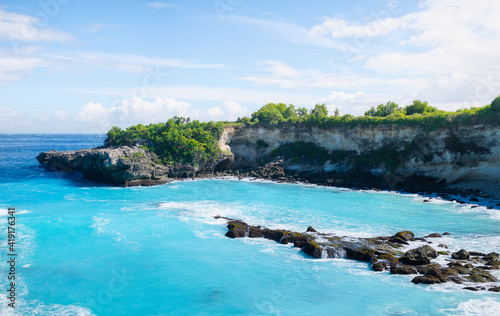 Seascape at the day time. Bay and rocks. Turquoise water background in the summer. Sea and beach. Nusa Penida, Bali, Indonesia. Travel and vacation image