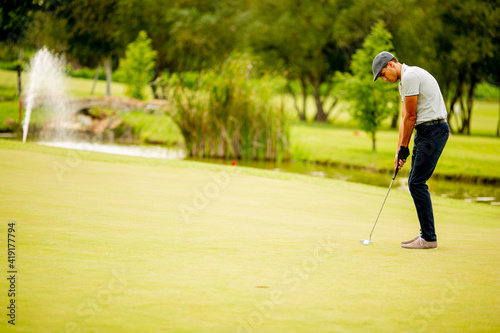 Young man playing golf
