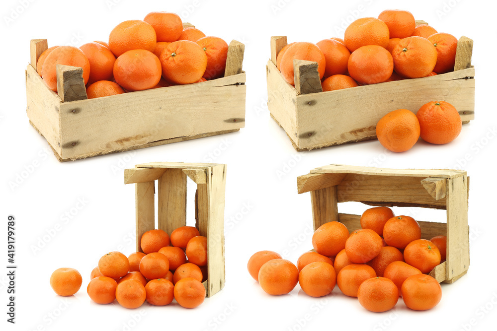 fresh tangerines in a wooden crate on a white background