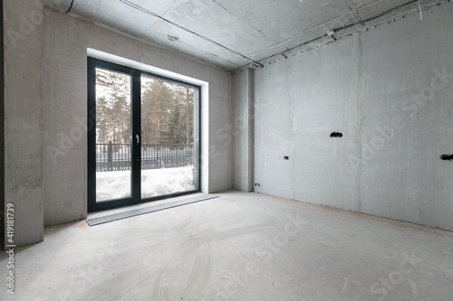 interior of the apartment without decoration in gray colors. rough finish