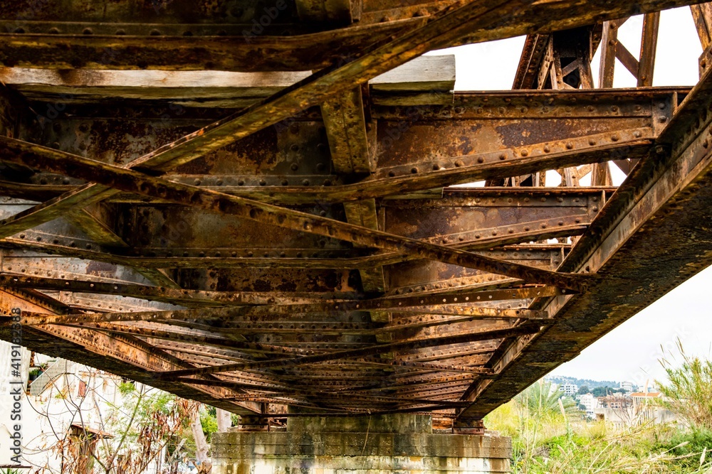 Obraz premium steel construction of an old out of service railroad bridge near Byblos in Lebanon