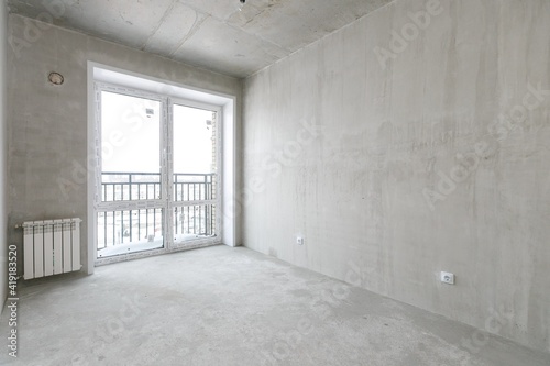 interior of the apartment without decoration in gray colors. rough finish
