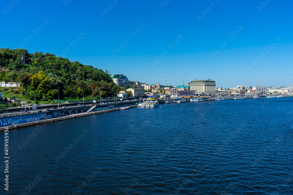 Panoramic view of Podol district and Dnypro river from pedestrian bridge in Kyiv, Ukraine on August 30, 2020. 