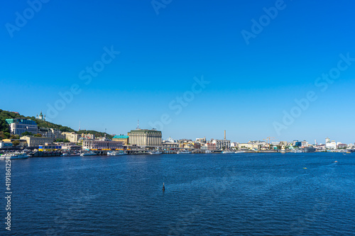 Panoramic view of Podol district and Dnypro river from pedestrian bridge in Kyiv, Ukraine on August 30, 2020.  © Vitali