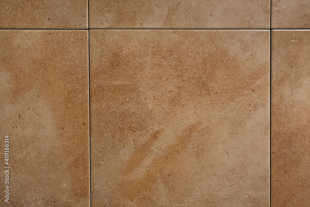 Fototapeta premium background of square ceramic tiles, with beige marble imitation, top view
