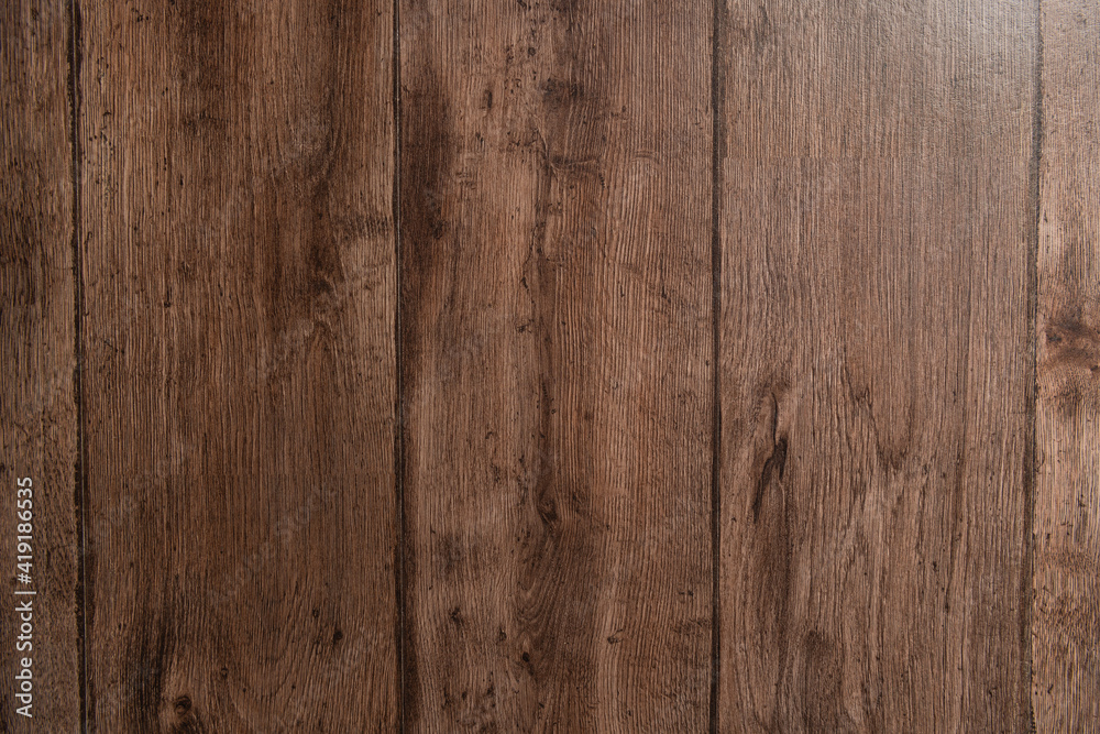 Fototapeta premium dark brown, natural wooden surface textured background, top view