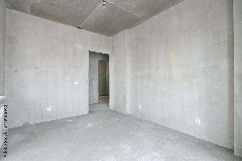 interior of the apartment without decoration in gray colors. rough finish interior of the apartment without decoration in gray colors. rough finish