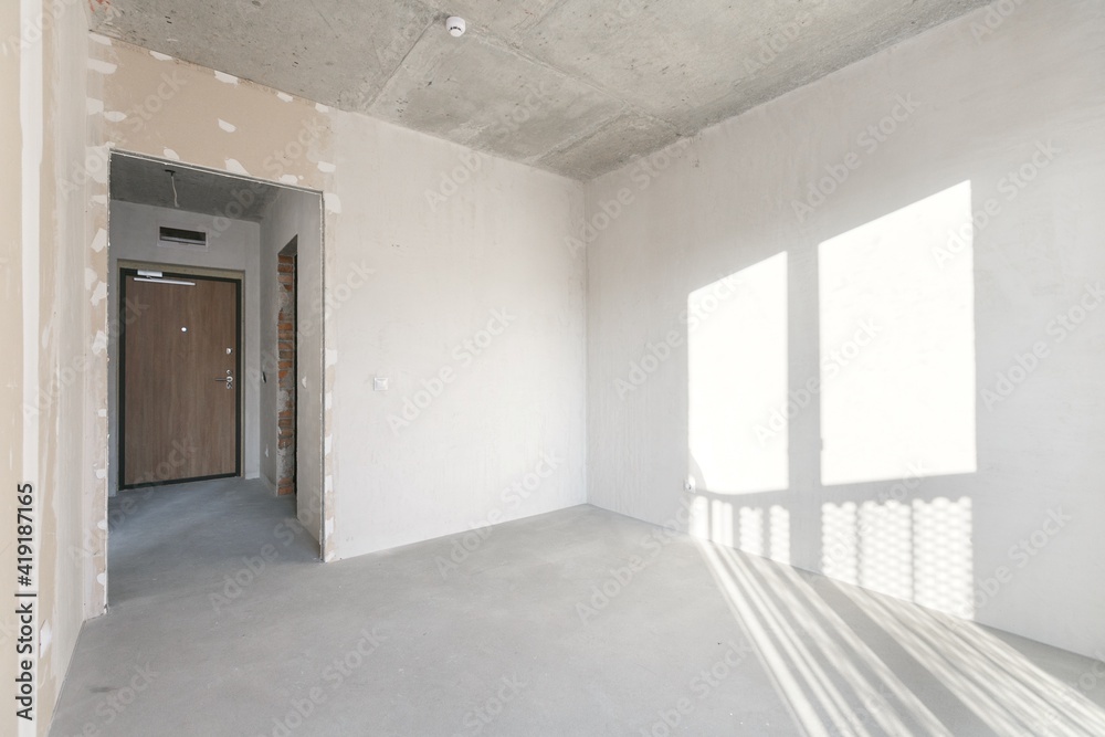 interior of the apartment without decoration in gray colors. rough finish interior of the apartment without decoration in gray colors. rough finish