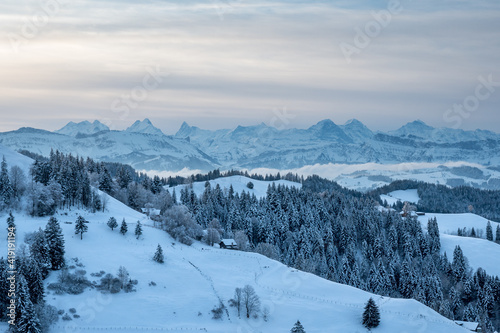 view from Lüderenalp over the hills of Emmental on beautiful winter morning in winter © schame87