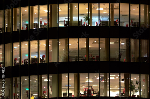 Multi-storey office building at night. Late night at office. Late night overtime in a modern office building