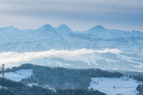 Eiger Mönch and Jungfrau and the landscape of Emmental in winter © schame87