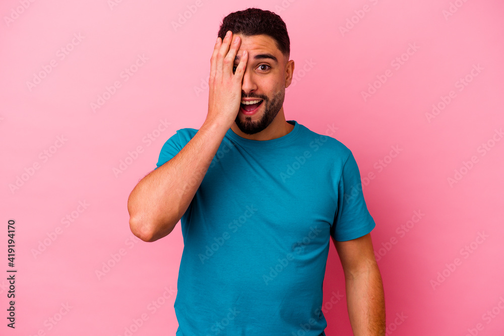Young mixed race man isolated on pink background Young mixed race man isolated on pink background