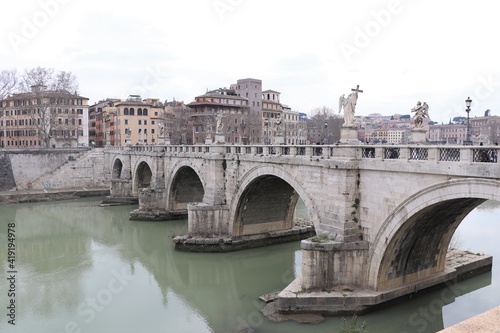 The Angel Bridge in Rome with Buildings in the Background