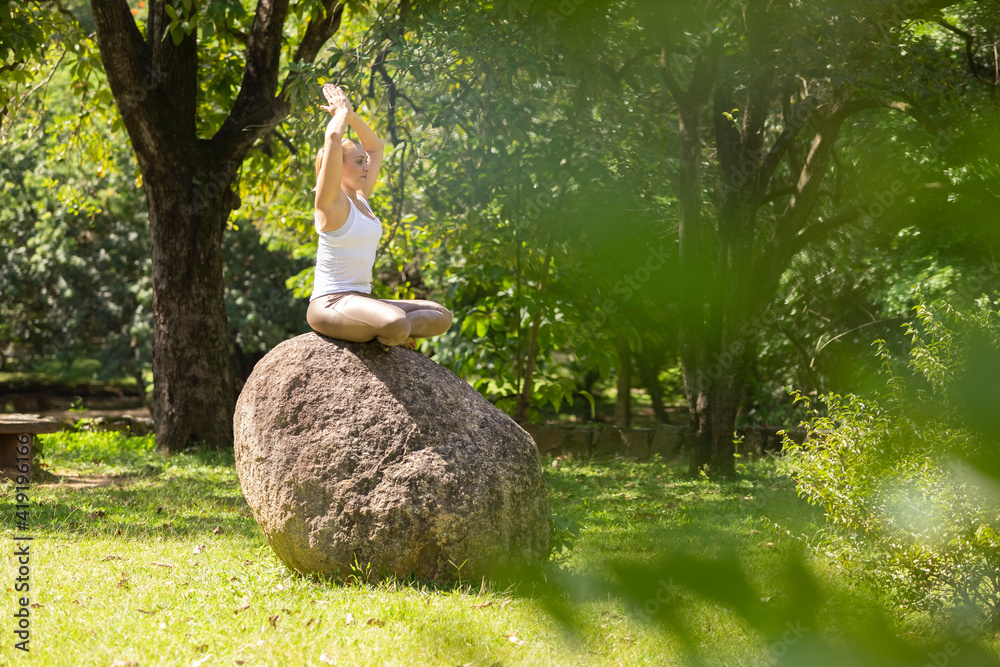 blonde woman practicing yoga in a park, Barueri, São Paulo, Brazil