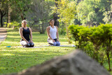 two women practicing yoga in a park, Barueri, São Paulo, Brazil