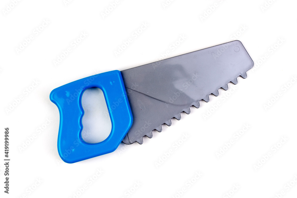 Toy. saw Isolated on white background. Copy space. Top view. Toy. saw Isolated on white background. Copy space. Top view.