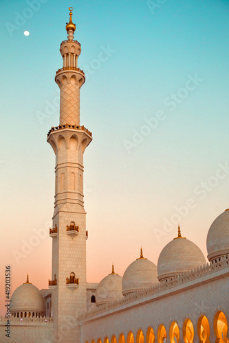 Beautiful colorful sunset with mosque domes and moon, Ramadan photo