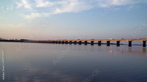Wallpaper Mural Beautiful view of bridge over the Uruguay River on the border of Uruguaiana city, Brazil and Paso de los Libres, Argentina on sunny summer day. Trucks driving on dusk.  Concept of travel, transport. Torontodigital.ca