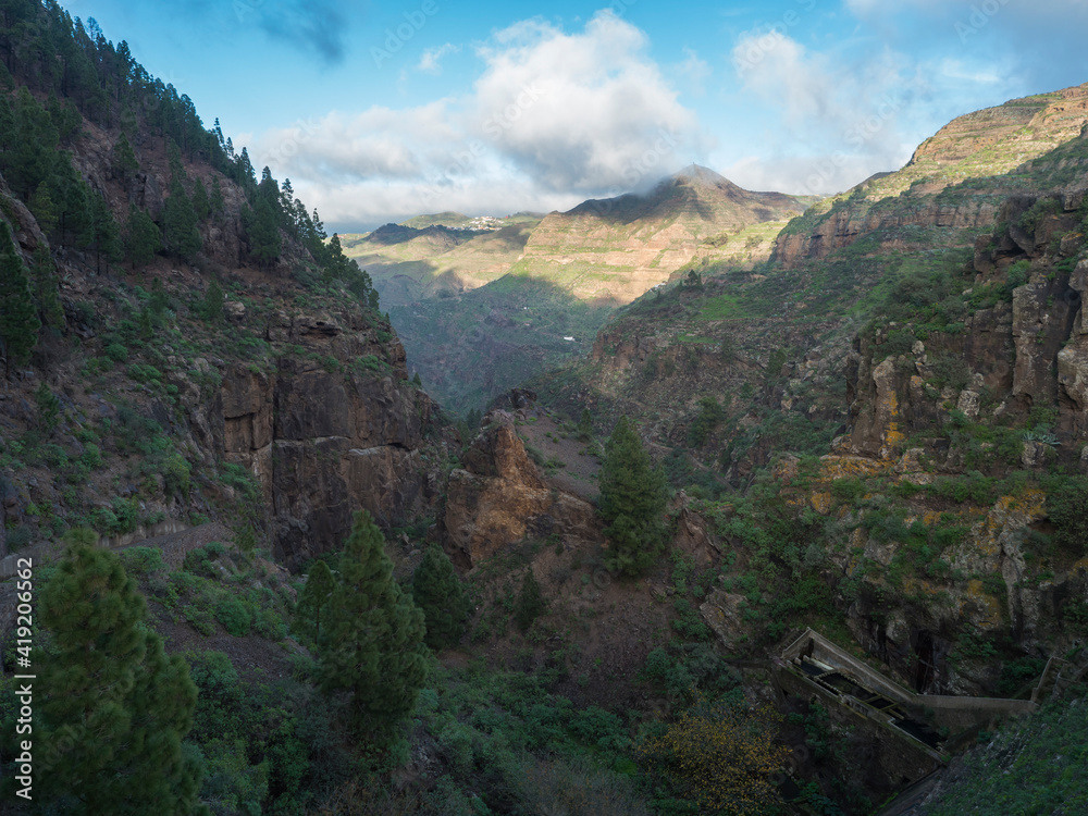 Scenic view of Tamadaba natural park with green hills, forest mountains and dam. Gran Canaria, Canary Islands, Spain