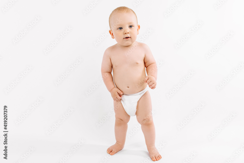 Smiling child standing on white studio background Smiling child standing on white studio background
