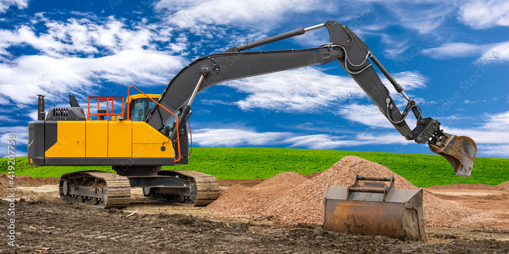 Bagger bei der Arbeit auf einer Baustelle Stock Photo | Adobe Stock