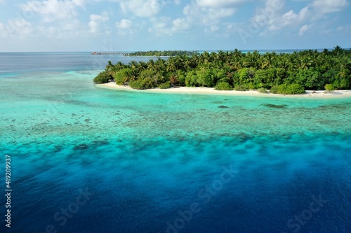 Bird's eye view of tropical islands in the ocean. View of the islands from a drone. Maldives, Thinadhoo (Vaavu Atoll), Dhigurah photo