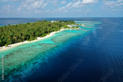 Bird's eye view of tropical islands in the ocean. View of the islands from a drone. Maldives, Thinadhoo (Vaavu Atoll), Dhigurah