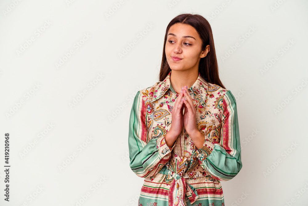 Young Indian woman isolated on white background making up plan in mind, setting up an idea. Young Indian woman isolated on white background making up plan in mind, setting up an idea.