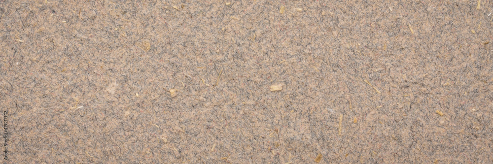 background and texture of brown cotton paper with flax straw, panoramic web banner background and texture of brown cotton paper with flax straw, panoramic web banner