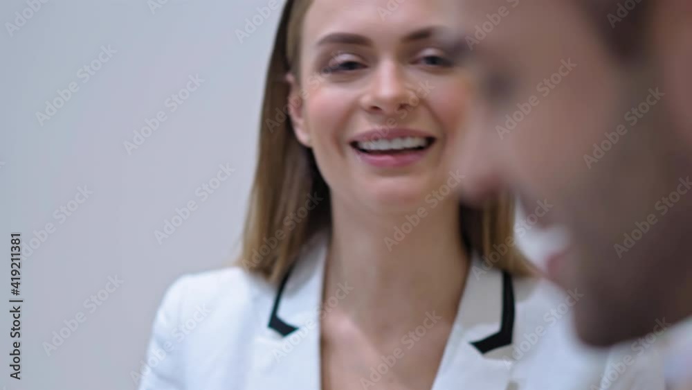 Flirt concept. Cheerful businesswoman happy talking to a client. Business negotiations, communication with a client. Man talking to female employee having a conversation in the office. 4k footage. Flirt concept. Cheerful businesswoman happy talking to a client. Business negotiations, communication with a client. Man talking to female employee having a conversation in the office. 4k footage.