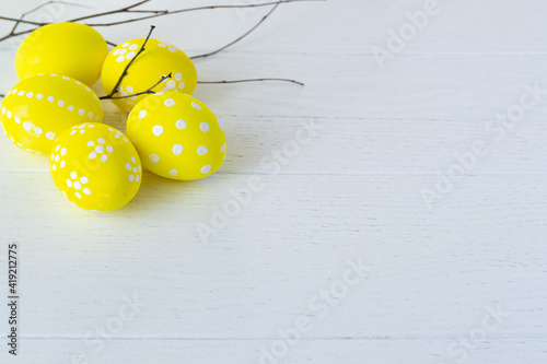 Easter eggs to decorate the Easter holidays advertising discount promotion place for text on a yellow background white coronavirus photo