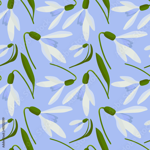 Snowdrops vector. Snowdrops in spring seamless vector pattern. Vector pattern snowdrops.Snowdrops on a blue background.