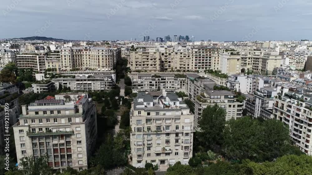 Low altitude aerial view of the 16th arrondissement of Paris is one of the 20 arrondissements of the capital city of France showing La Defense neighbourhood in background 4k high resolution footage Low altitude aerial view of the 16th arrondissement of Paris is one of the 20 arrondissements of the capital city of France showing La Defense neighbourhood in background 4k high resolution footage