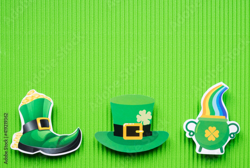 St Patricks Day symbols on green background with copy space