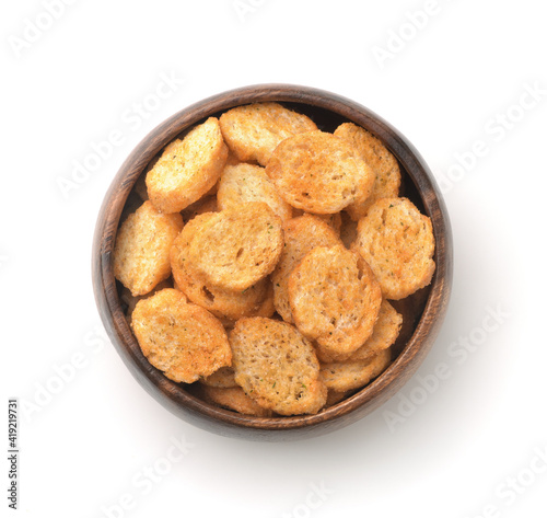 Top view of wheat croutons in wooden bowl