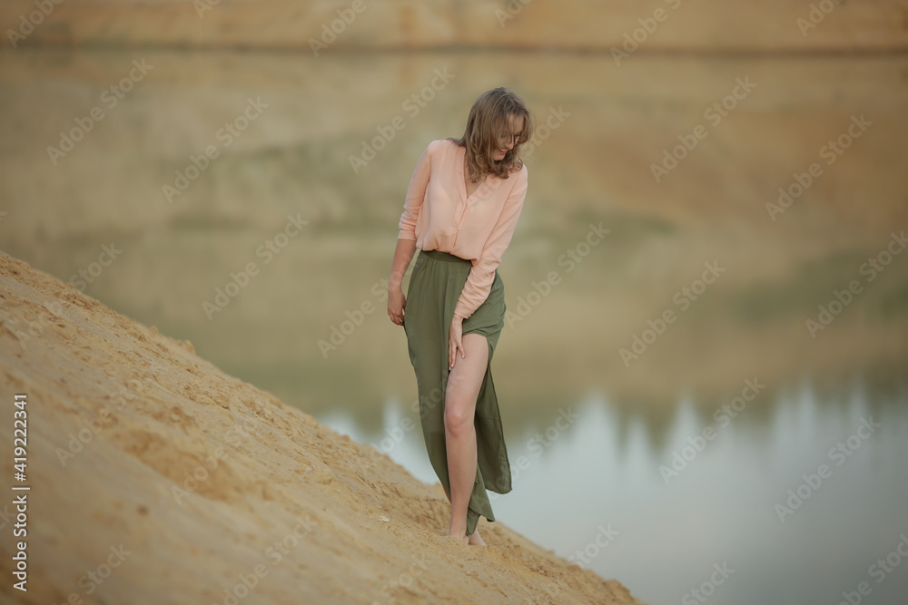 beautiful cheerful woman by the lake. beautiful cheerful woman by the lake.
