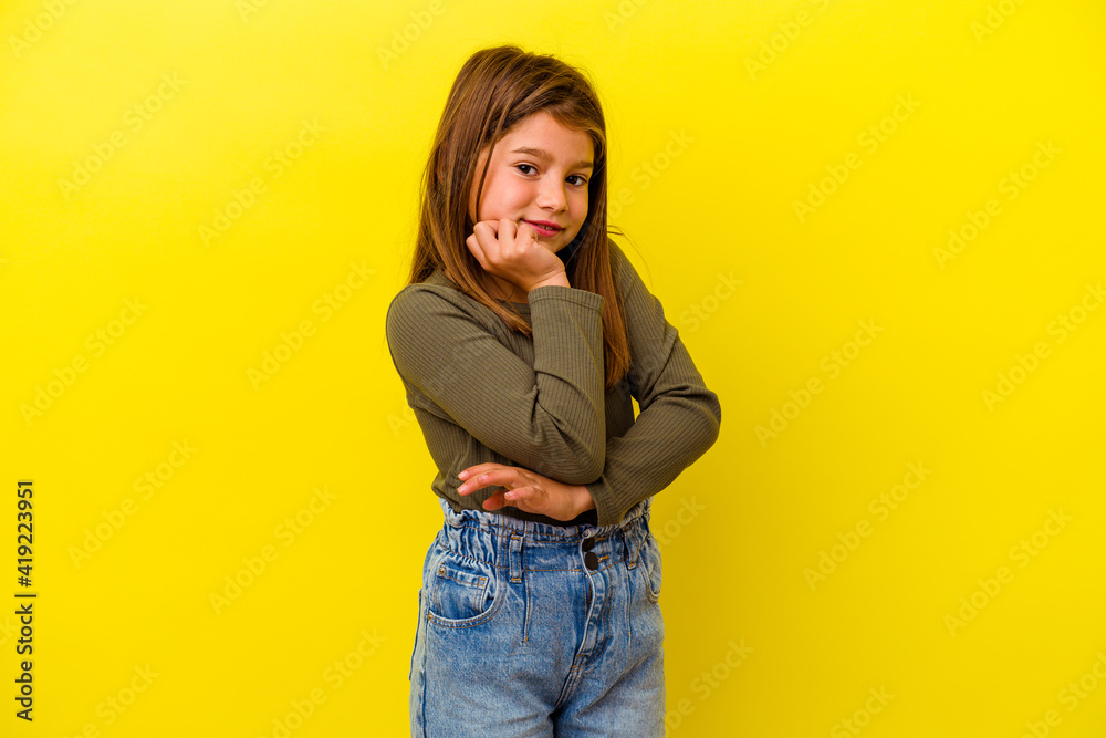 Little caucasian girl isolated on yellow background smiling happy and confident, touching chin with hand. Little caucasian girl isolated on yellow background smiling happy and confident, touching chin with hand.