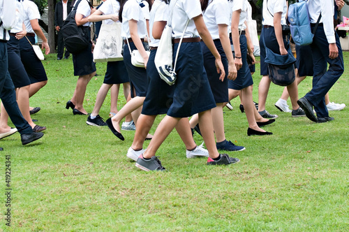Students gather in a field