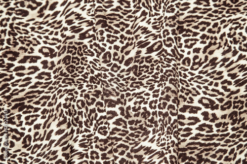 Leopard print pattern fabric texture repeat background effect leopard fabric sample.
