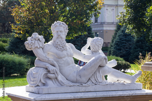 Antique sculpture of Zeus in the park