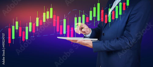 stock trader analyzing stock graph